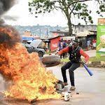 An NUP supporter burns the tarmac.